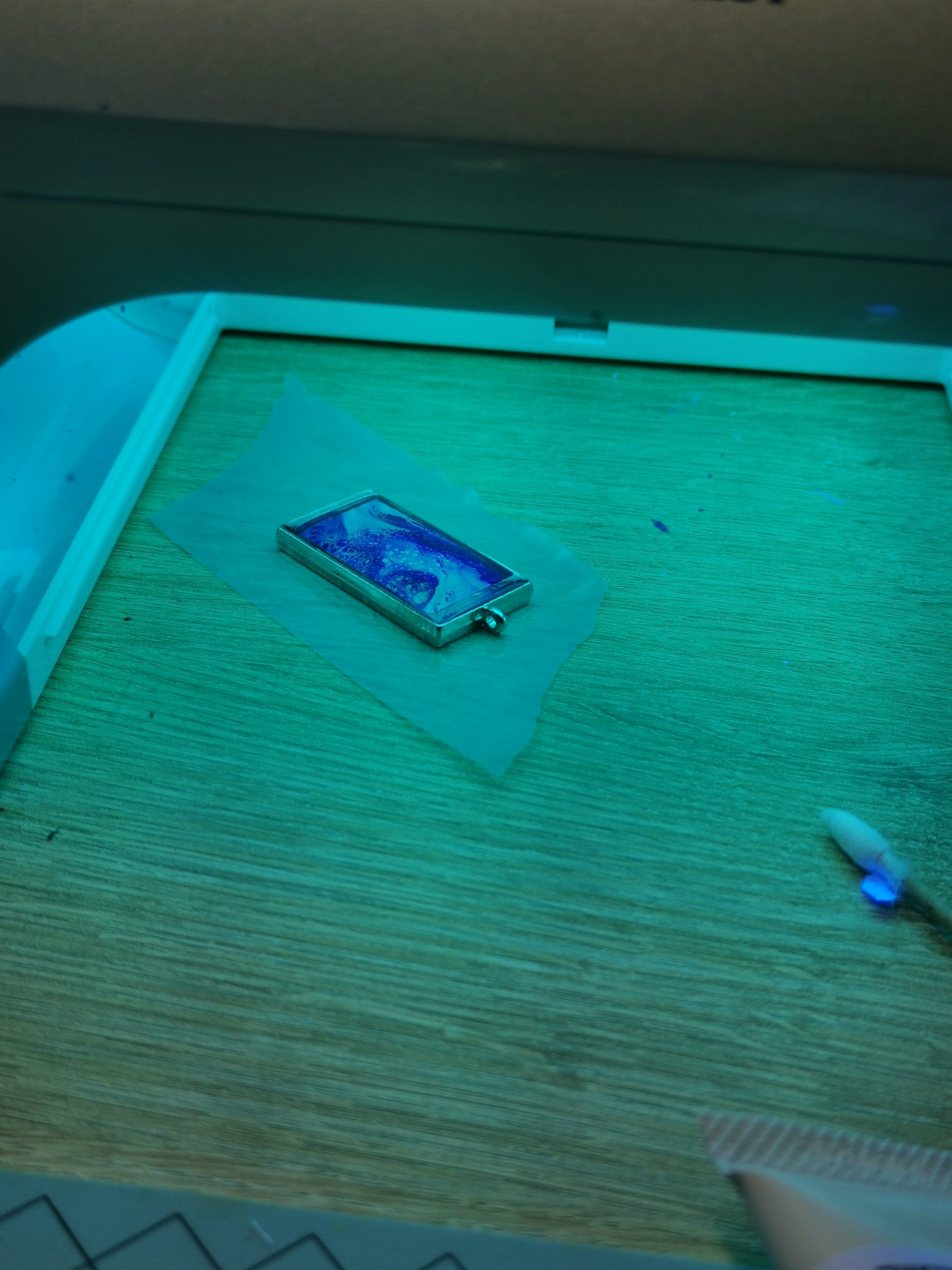 Close-up while curing UV resin pendant