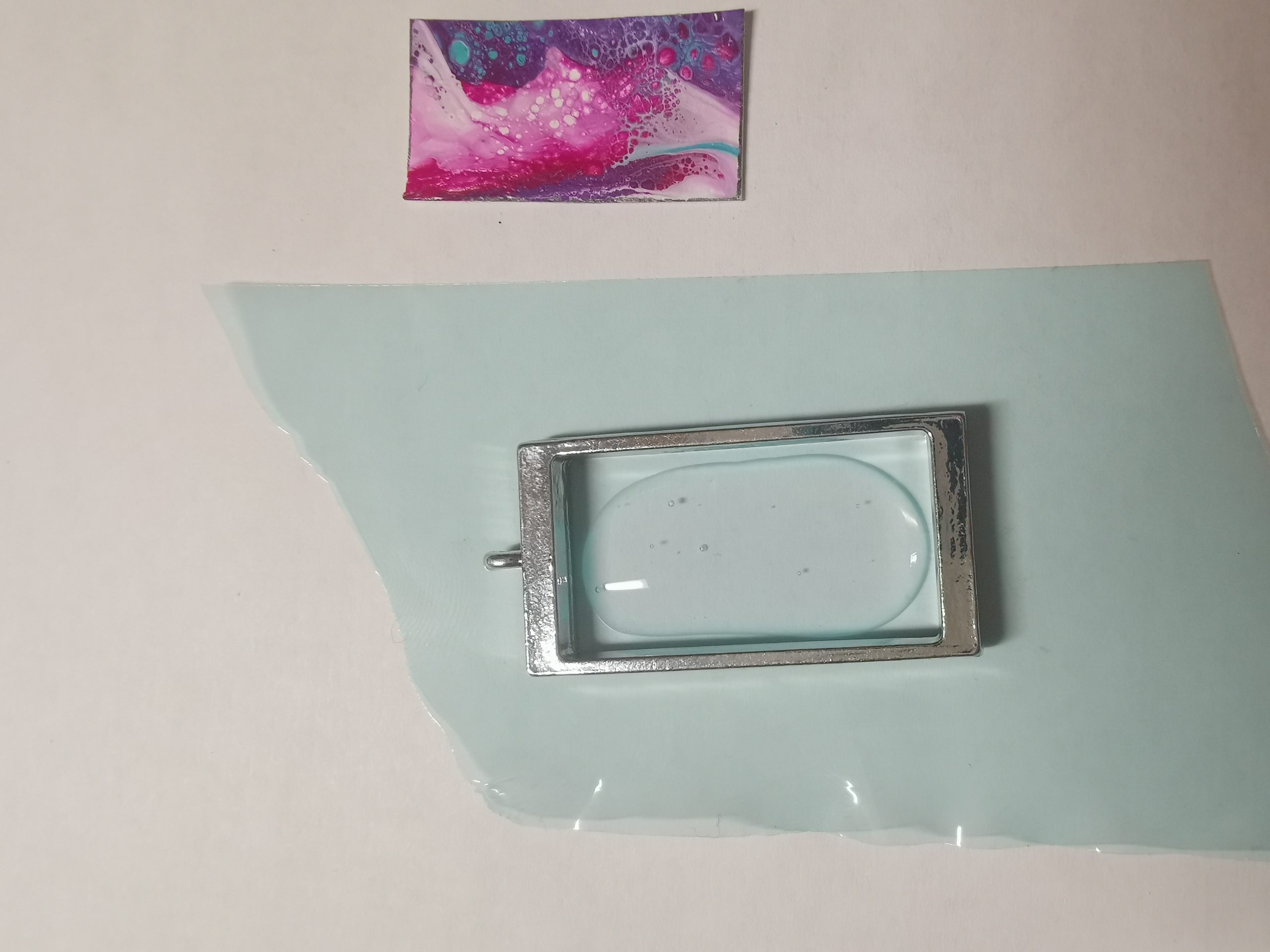 Pendant frame with UV resin on resin tape