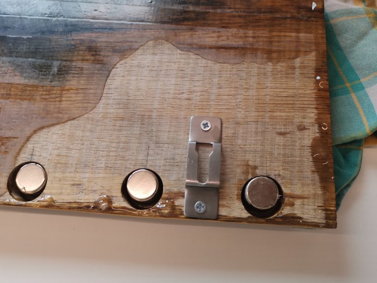 Then I screwed sturdy hooks into the block to mount it on the wall.